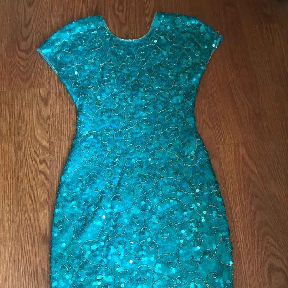 Turquoise sequin dress with gold accent beading.